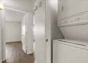 Thumbnail 5 of 11 - a white kitchen with a washer and dryer in it