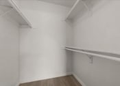 Thumbnail 9 of 11 - a white room with a white wall and a shelf on the wall