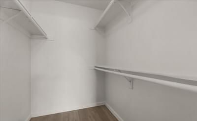 a white room with a white wall and a shelf on the wall
