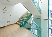 Thumbnail 3 of 3 - a glass staircase in a building with a glass railing