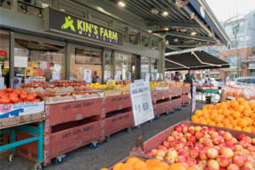 a farmers market filled with lots of different types of fruit