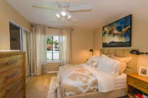 Large bed in bedroom at Mirabella Apartments, Bermuda Dunes, California