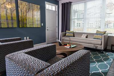 A living room with a grey couch and a coffee table.