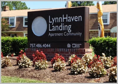 Entrance sign for Lynnhaven Landing Apartments, an affordable housing community in Virginia Beach, VA