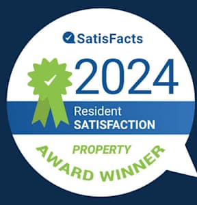 A badge indicating a property award winner for resident satisfaction in 2024.
