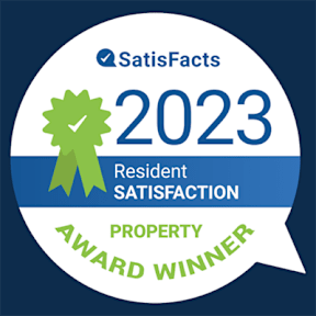 A badge indicating a property award winner for resident satisfaction in 2023.