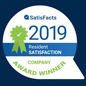 A badge indicating a company as the award winner for resident satisfaction in 2019.