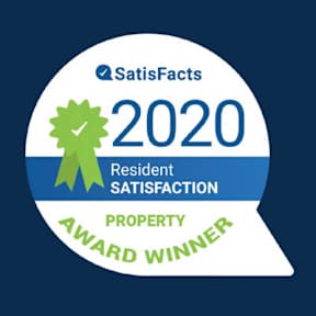 A badge indicating a property award winner for resident satisfaction in 2020.