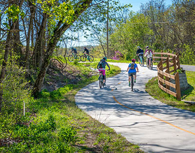 Bike trail with people on bikes at Crocker Village – Single Family Homes, California