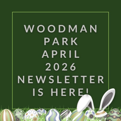 a green sign that says woodland park december 23 23 newspaper is here