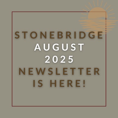 a red wall with a sign that saysstonebridge apartment homes may 23 23 newsletter is here