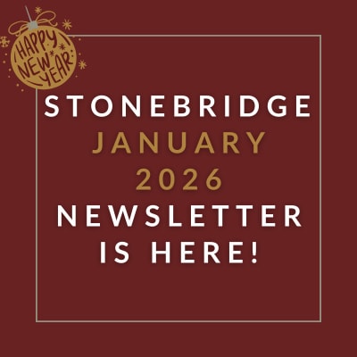 a red wall with a sign that saysstonebridge apartment homes may 23 23 newsletter is here