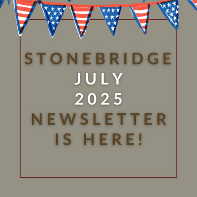a red wall with a sign that saysstonebridge apartment homes may 23 23 newsletter is here