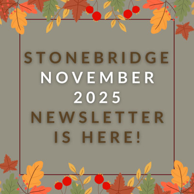 a red wall with a sign that saysstonebridge apartment homes may 23 23 newsletter is here