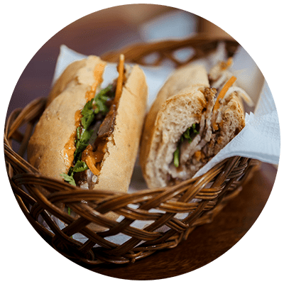 two sandwiches in a basket on a table