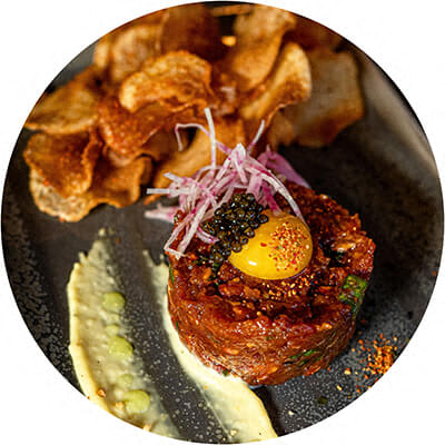 A plate of food with a fried egg on top.