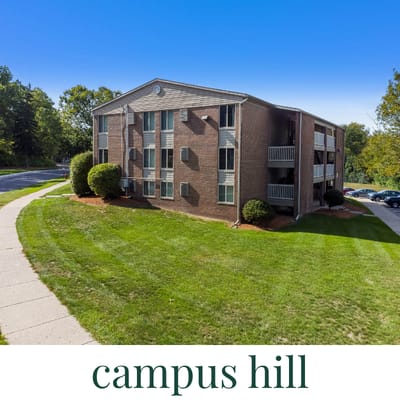 A brick building with the words "campus hill" written below it.