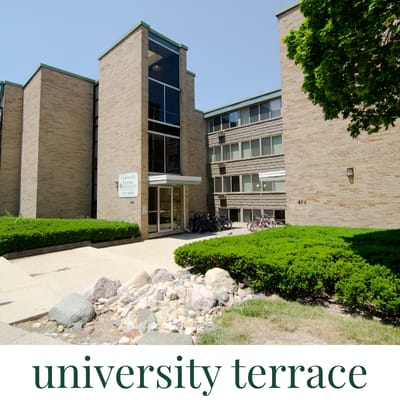 A university building with a sign that says university terrace.