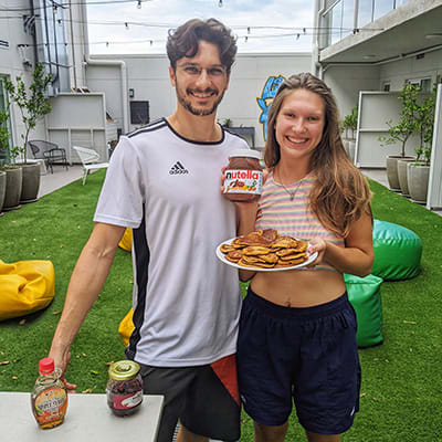a man and a woman holding a plate of food