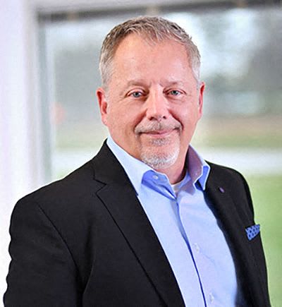 a man in a suit and shirt and tie