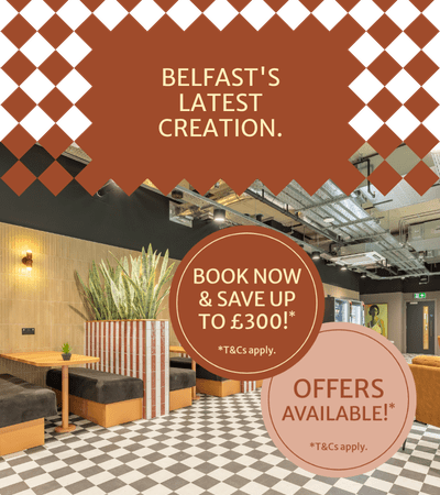 A room with a table and chairs and a sign that says Biscuit Factory.
