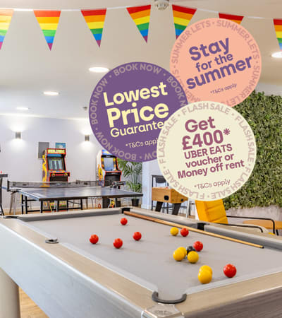 A room with a sign offering a £100 Amazon voucher for referring a friend.