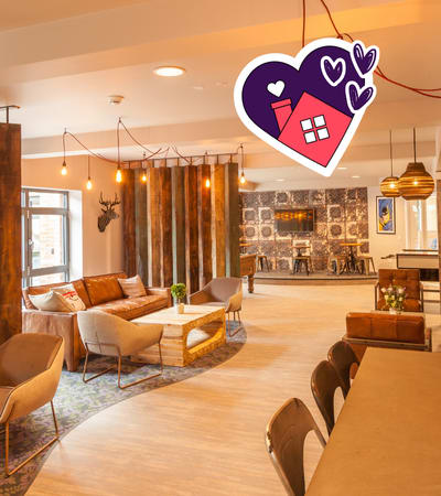 A living room with a heart-shaped decoration and a house icon on it.