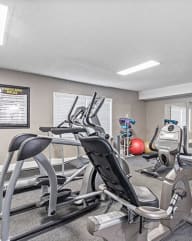 a gym with cardio equipment and exercise equipment