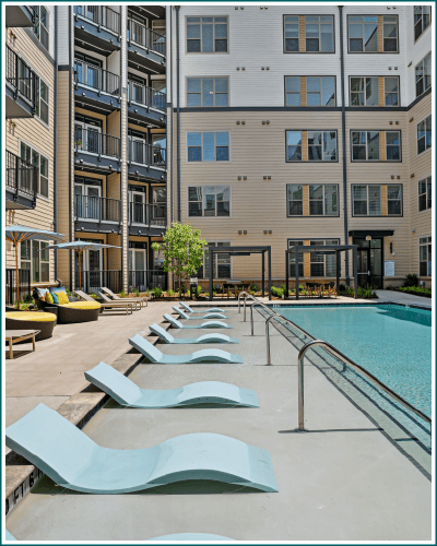 Clubhouse fireplace and event kitchen at Link Apartments NODA 36th in Charlotte, NC.