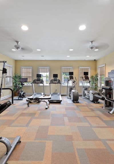 spacious fitness center with cardio and strength equipment at Fenwyck Manor Apartments