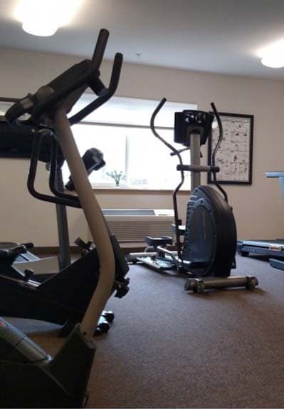 a gym with an exercise bike and a windowat VINTAGE AT BURIEN, Burien, WA 98168