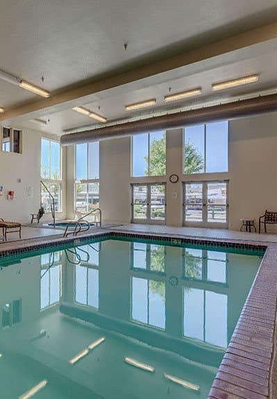 a large pool in a room with a large window at VINTAGE AT SPOKANE, Spokane Washington