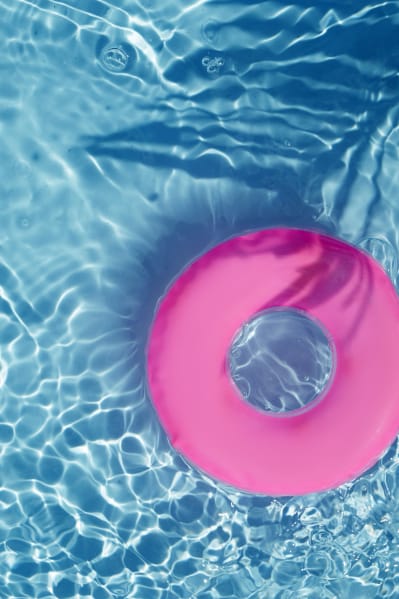 a pink and blue float in a swimming pool