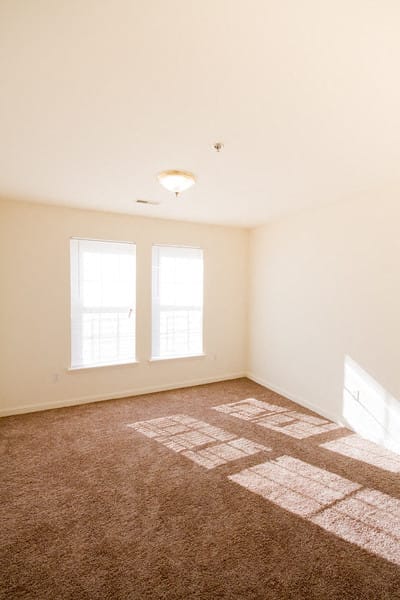 bedroom with carpeted floors and white walls