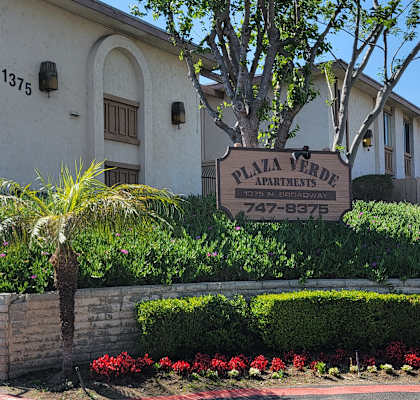 a large white building with a sign in front of it