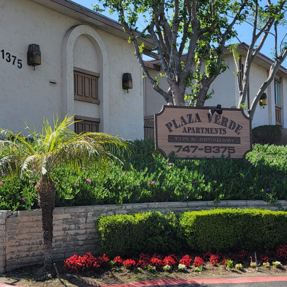 a large white building with a sign in front of it