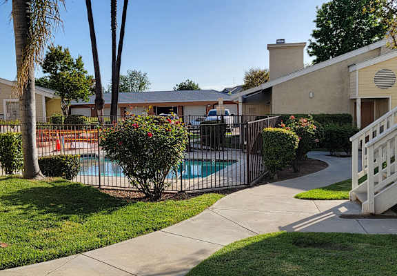 a swimming pool in front of a house