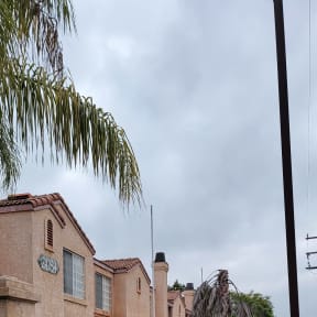 Looking at front view of the townhomes from the enterance drivway at Palos Verdes Village Townhomes in Moreno Valley, California.