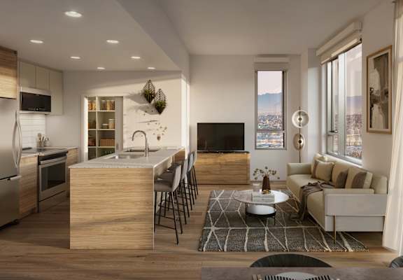 A modern kitchen with a dining table and chairs.
