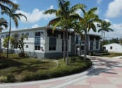 Thumbnail 1 of 12 - a building with palm trees in front of it  at Palm Gardens @ Biscayne Gardens, North Miami, 33181