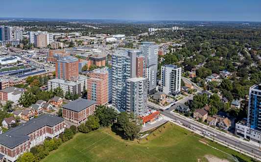 A cityscape with a mix of residential and commercial buildings.