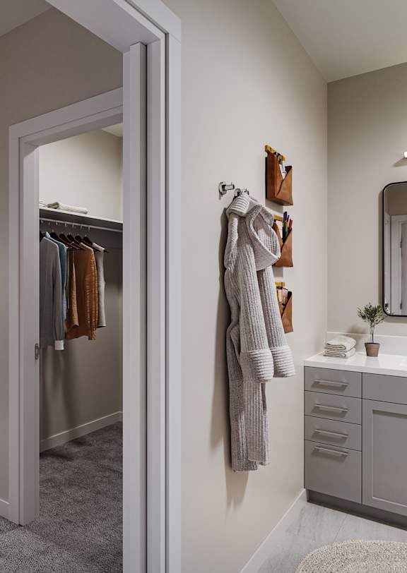 A bedroom with a bed, a dresser, and a mirror.