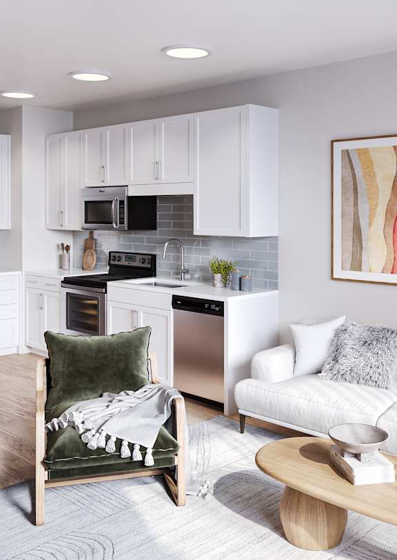 A modern kitchen with a refrigerator, stove, and oven.