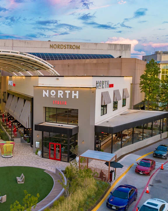 A Nordstrom store is shown with a parking lot in front.
