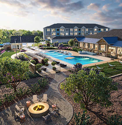 A large building with a pool in front of it.