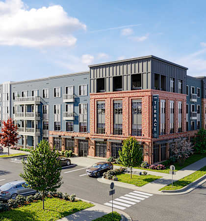 A street view of a row of modern buildings.