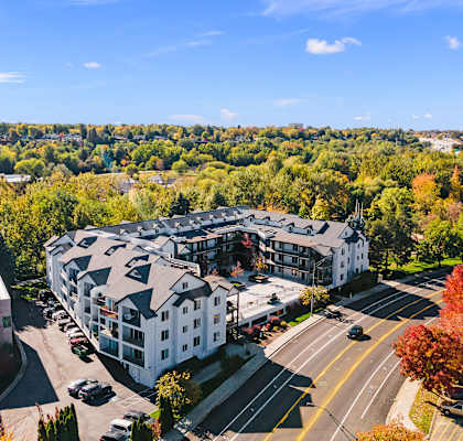 an aerial view of an apartment building in the city at River Walk Apartments, Boise, ID, 83702