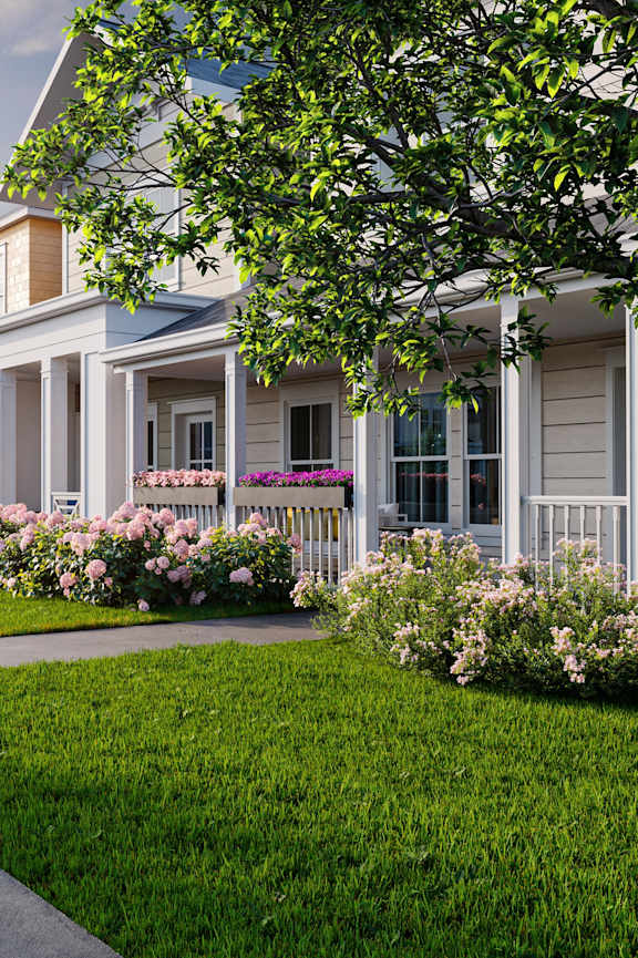 A row of houses with a sidewalk in front. at Allier Foley in Foley, AL