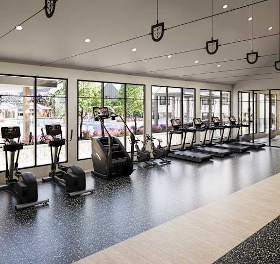 a group of people running on a treadmill in a gym