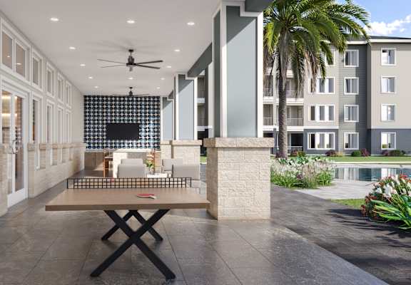Outdoor Lounge with Yard Games at Cedar Heights Luxury Apartments in Austin, TX